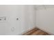 Small laundry room includes newly installed flooring and space for utilities at 1261 Cliffwood Se Dr, Smyrna, GA 30080