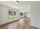 Sun-filled living room with recently installed floors and large windows at 1261 Cliffwood Se Dr, Smyrna, GA 30080