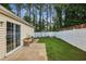 A fenced backyard features a well manicured lawn and mature trees at 2657 Albion Farm Way, Duluth, GA 30097