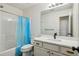 Updated bathroom featuring white cabinets, an updated sink, and tub shower combo at 2657 Albion Farm Way, Duluth, GA 30097