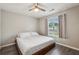 A bedroom with a ceiling fan and a window at 2657 Albion Farm Way, Duluth, GA 30097