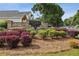 Stone entrance to The Village at Albion Farm features manicured landscaping and signage at 2657 Albion Farm Way, Duluth, GA 30097