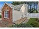 Charming home with red shutters, brick accents, sidewalk, and a privacy fence at 2657 Albion Farm Way, Duluth, GA 30097