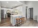 Bright kitchen with white cabinets, stainless steel appliances, and a breakfast bar with stools at 2657 Albion Farm Way, Duluth, GA 30097