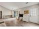 Spacious living room with wood floors, white shelving, and a sliding glass door to the outside at 2657 Albion Farm Way, Duluth, GA 30097