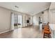 Open concept living space with wood floors, a kitchen view, and a sliding glass door at 2657 Albion Farm Way, Duluth, GA 30097