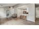 Large living room with hardwood floors, an open kitchen, and multiple entryways at 2657 Albion Farm Way, Duluth, GA 30097