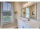 Bright bathroom with double vanity, large mirror and lots of natural light at 3508 Cox Cemetery Rd, Social Circle, GA 30025