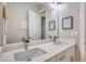 Modern bathroom with double sinks, a large mirror, and sleek countertops at 3508 Cox Cemetery Rd, Social Circle, GA 30025