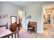 Cozy bedroom featuring hardwood floors, desk, and walk-in closet at 3508 Cox Cemetery Rd, Social Circle, GA 30025