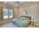 Bright bedroom featuring decorative ceiling, light wood floors, and a beautiful view at 3508 Cox Cemetery Rd, Social Circle, GA 30025