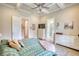This large bedroom has a decorative ceiling, light wood floors, and lots of storage at 3508 Cox Cemetery Rd, Social Circle, GA 30025