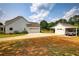 Beautiful backyard with a detached garage and portico and plenty of parking on a sunny day at 3508 Cox Cemetery Rd, Social Circle, GA 30025