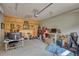 Spacious garage featuring wooden accent wall, concrete flooring and ample storage space at 3508 Cox Cemetery Rd, Social Circle, GA 30025