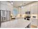 Bright, modern kitchen with stainless steel appliances and white countertops at 3508 Cox Cemetery Rd, Social Circle, GA 30025