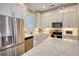 Well-lit kitchen with stainless steel appliances, island with seating, and a stylish design at 3508 Cox Cemetery Rd, Social Circle, GA 30025