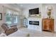 Comfortable living room features fireplace, television, and a scenic view at 3508 Cox Cemetery Rd, Social Circle, GA 30025