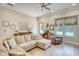 Comfortable living room with neutral colors, hardwood floors, and large windows at 3508 Cox Cemetery Rd, Social Circle, GA 30025