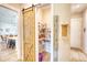 Walk-in pantry with wooden sliding barn door provides easy access to kitchen and storage at 3508 Cox Cemetery Rd, Social Circle, GA 30025