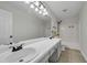 Bathroom with double sinks, a large mirror, and a shower-tub combination at 3943 Alexandra Oak Ct, Suwanee, GA 30024