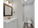 Contemporary bathroom features vanity with sink and mirror, plus tiled shower at 3943 Alexandra Oak Ct, Suwanee, GA 30024
