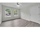 Bedroom featuring lots of natural light and hardwood floors at 3943 Alexandra Oak Ct, Suwanee, GA 30024