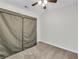 Cozy bedroom features carpeted floors and a portable closet for organized storage at 3943 Alexandra Oak Ct, Suwanee, GA 30024