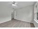 Spacious bedroom with a ceiling fan and natural light at 3943 Alexandra Oak Ct, Suwanee, GA 30024