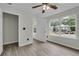 Bedroom with views of the outdoors through large windows at 3943 Alexandra Oak Ct, Suwanee, GA 30024