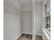 Bright closet space with shelves and hardwood flooring at 3943 Alexandra Oak Ct, Suwanee, GA 30024