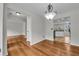 Light filled dining room featuring hardwood floors and a modern chandelier at 3943 Alexandra Oak Ct, Suwanee, GA 30024