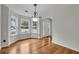 Bright dining room with hardwood floors, bay windows and decorative chandelier at 3943 Alexandra Oak Ct, Suwanee, GA 30024