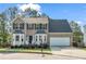 Charming two-story home with a brick facade, well-maintained lawn, and a two-car garage at 3943 Alexandra Oak Ct, Suwanee, GA 30024