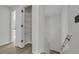 Hallway view including staircase with a view into the closet space at 3943 Alexandra Oak Ct, Suwanee, GA 30024