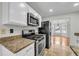 Well-appointed kitchen with granite countertops and stainless steel appliances at 3943 Alexandra Oak Ct, Suwanee, GA 30024