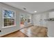 Bright kitchen featuring a window and a door with a view of trees at 3943 Alexandra Oak Ct, Suwanee, GA 30024