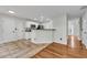 Kitchen with tile flooring and a breakfast bar overlooking the living room at 3943 Alexandra Oak Ct, Suwanee, GA 30024