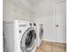 Bright laundry room includes a washer and dryer at 3943 Alexandra Oak Ct, Suwanee, GA 30024
