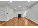 Spacious living room showcasing hardwood floors and a cozy fireplace at 3943 Alexandra Oak Ct, Suwanee, GA 30024