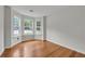 Inviting room with hardwood floors, natural light from bay windows, and fresh paint at 3943 Alexandra Oak Ct, Suwanee, GA 30024