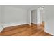 Cozy room with hardwood floors, fresh paint, and ample space for furnishings at 3943 Alexandra Oak Ct, Suwanee, GA 30024