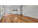 Open-concept living area with hardwood floors leading to the kitchen at 3943 Alexandra Oak Ct, Suwanee, GA 30024