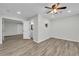 Bright room with ceiling fan has easy access to an additional room and bathroom at 3943 Alexandra Oak Ct, Suwanee, GA 30024