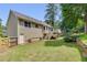 Well-maintained backyard with lush lawn, privacy fence, and deck access at 503 Silver Maple Ln, Woodstock, GA 30189