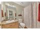 Neutral bathroom featuring a shower/tub combo and a wooden vanity at 503 Silver Maple Ln, Woodstock, GA 30189