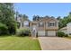 Charming two-story home with a well-maintained lawn, two-car garage and inviting front porch at 503 Silver Maple Ln, Woodstock, GA 30189