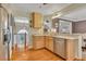 Open kitchen design with hardwood floors, stainless appliances, and views of the staircase at 503 Silver Maple Ln, Woodstock, GA 30189