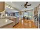 Spacious open kitchen with stainless appliances, stone countertops, and hardwood floors at 503 Silver Maple Ln, Woodstock, GA 30189