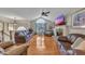 Spacious living room with hardwood floors, a ceiling fan and a large window providing natural light at 503 Silver Maple Ln, Woodstock, GA 30189