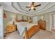 Spacious main bedroom with tray ceiling and nice furnishings at 503 Silver Maple Ln, Woodstock, GA 30189